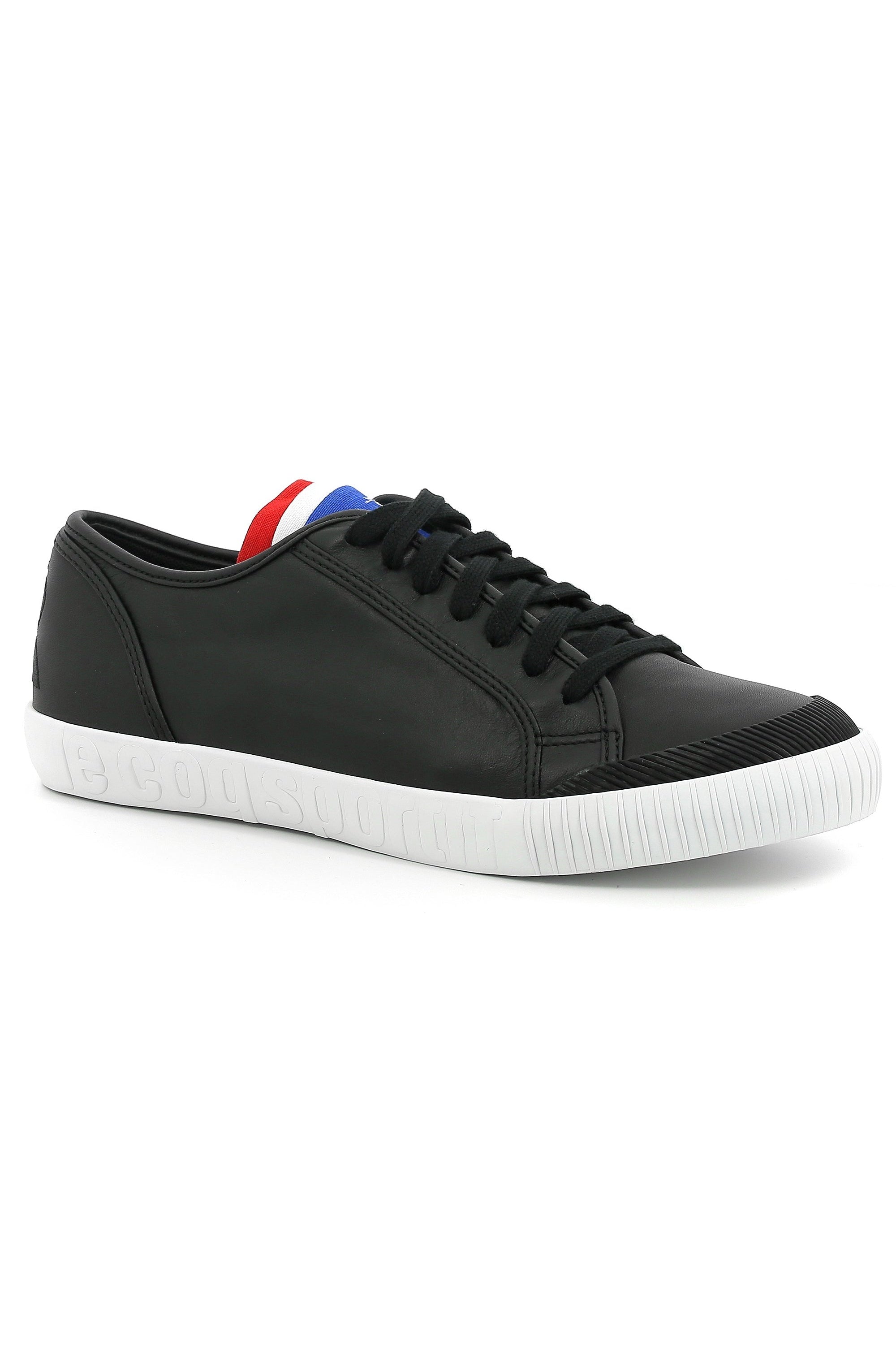 Black sneaker with white sole on a white background