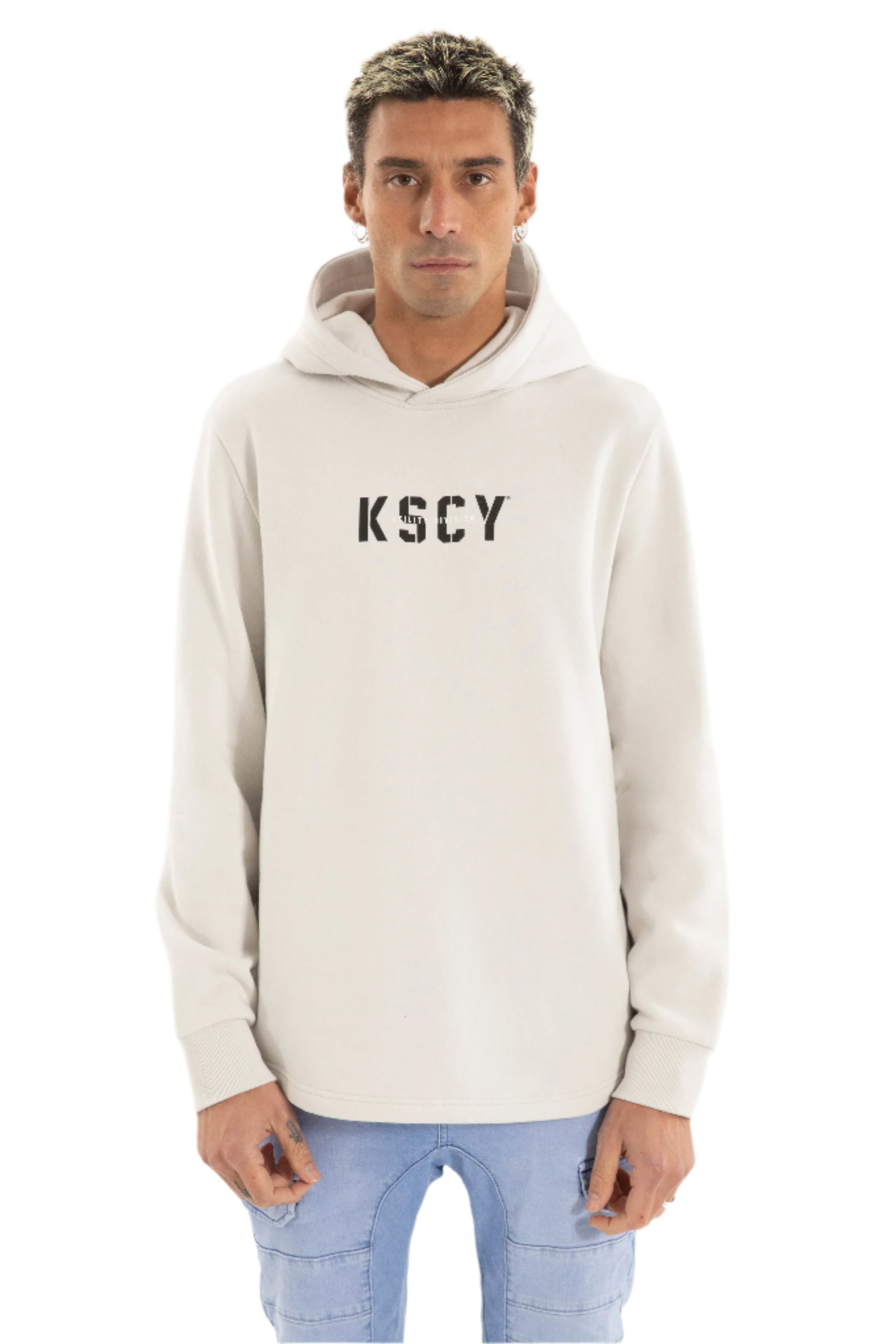 Man wearing a grey hoodie with 'KSCY' text 