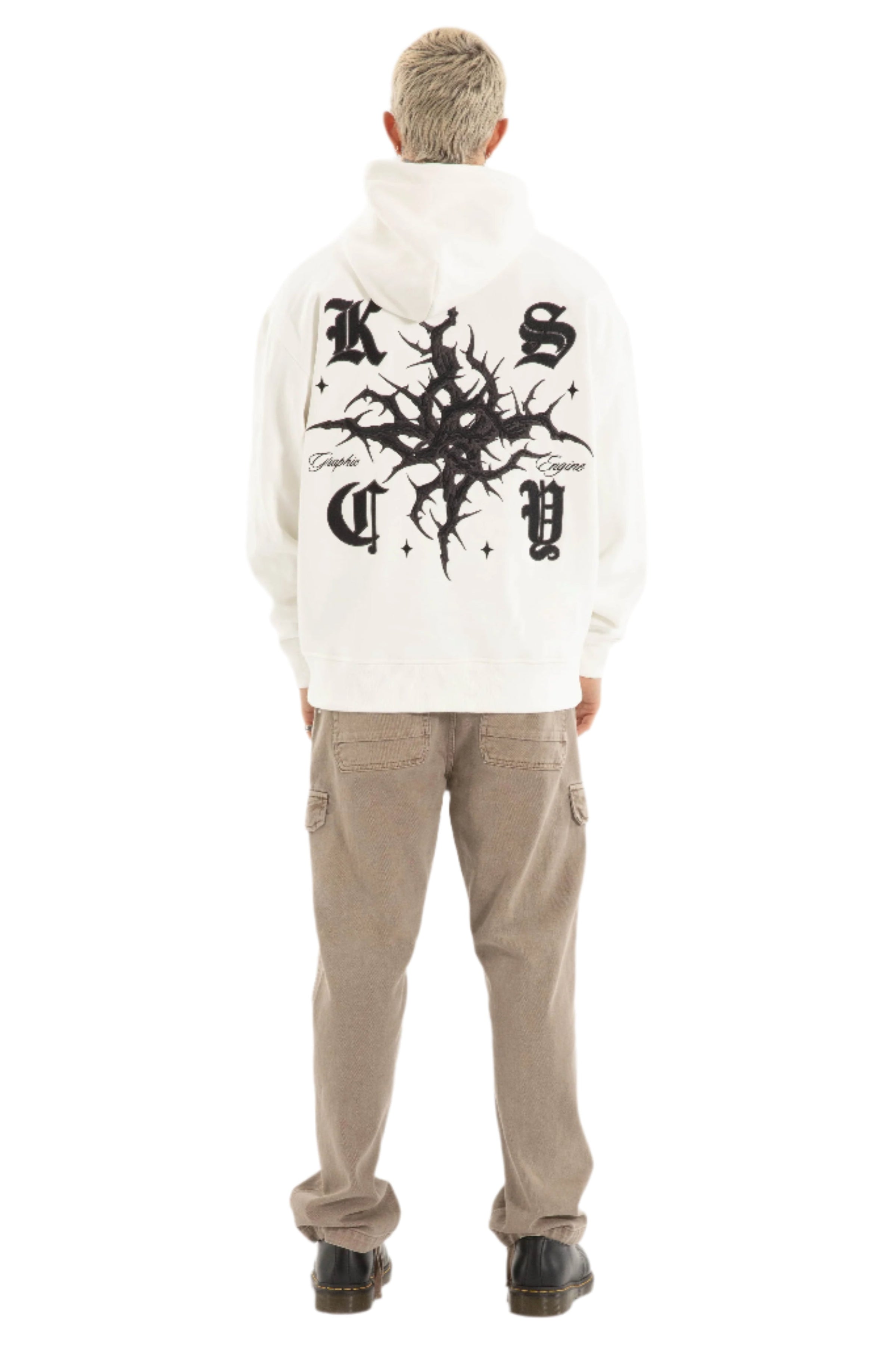 Person wearing a white hoodie with Kiss Chacey designs and text, paired with beige cargo pants on a light gray background. 