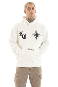 Person wearing a white hoodie with black graphics and text on a plain background