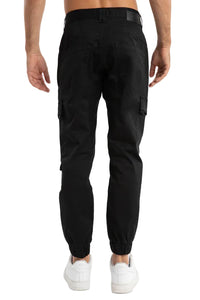 Black cargo pants worn by a person on a light gray background