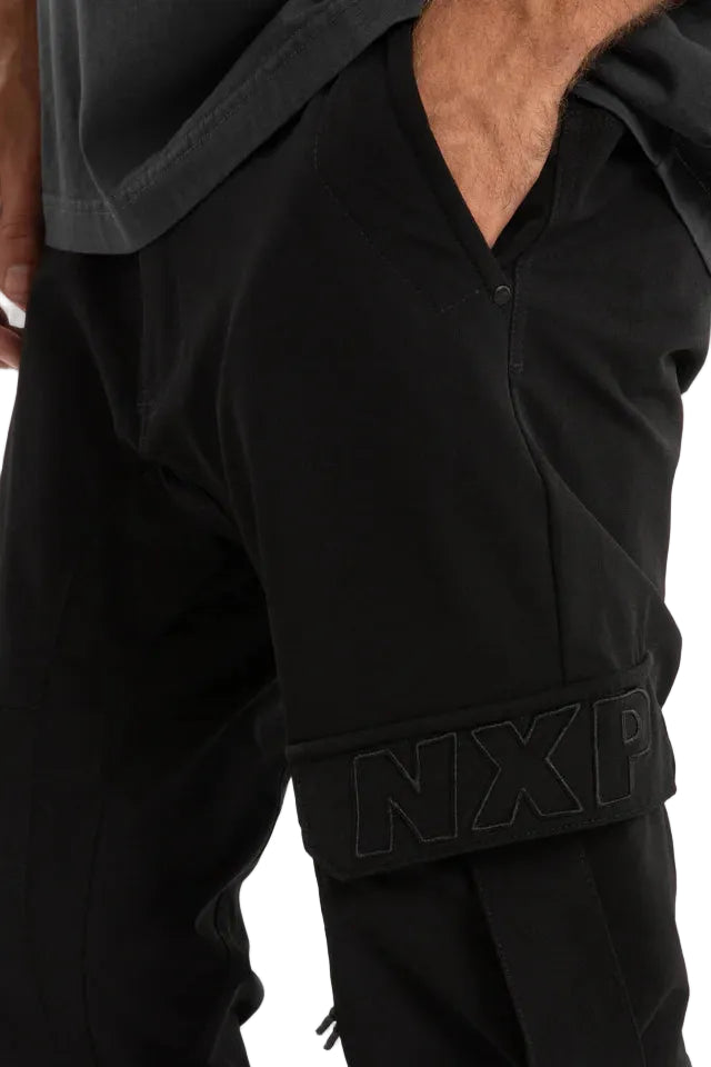 Black tracksuit with 'NXP' branding on a white background