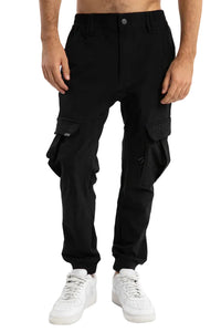 Person wearing black cargo pants on a light gray background