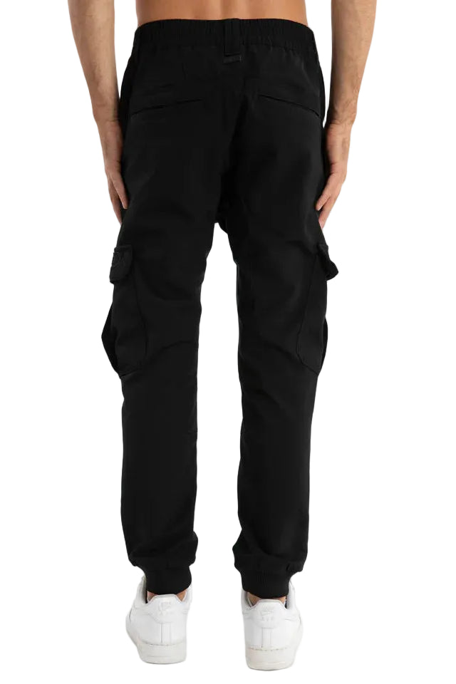 Black cargo pants worn by a person on a light gray background