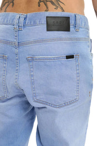 Light blue jeans with a brand label on a white background