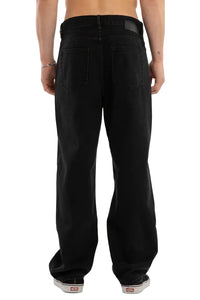 Person wearing black pants on a white background