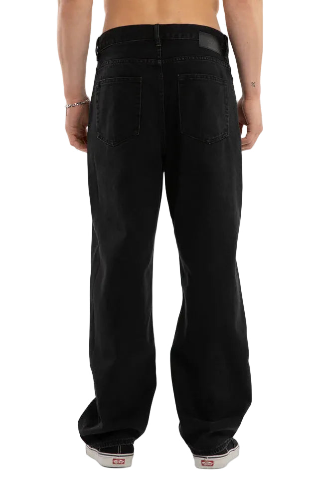 Person wearing black pants on a white background