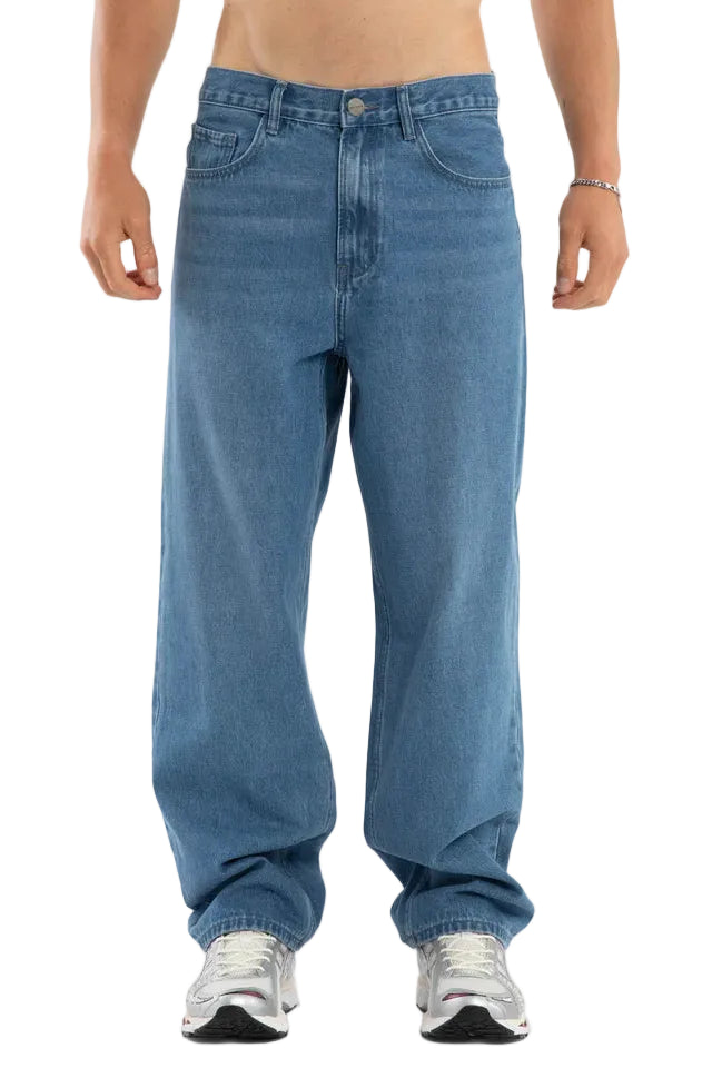 Person wearing blue jeans on a white background