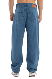 Blue jeans worn by a person on a white background