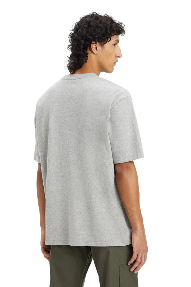 Person wearing a gray t-shirt on a white background