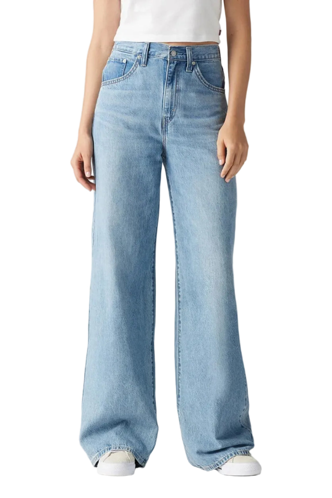 Light blue jeans worn by a person on a plain background