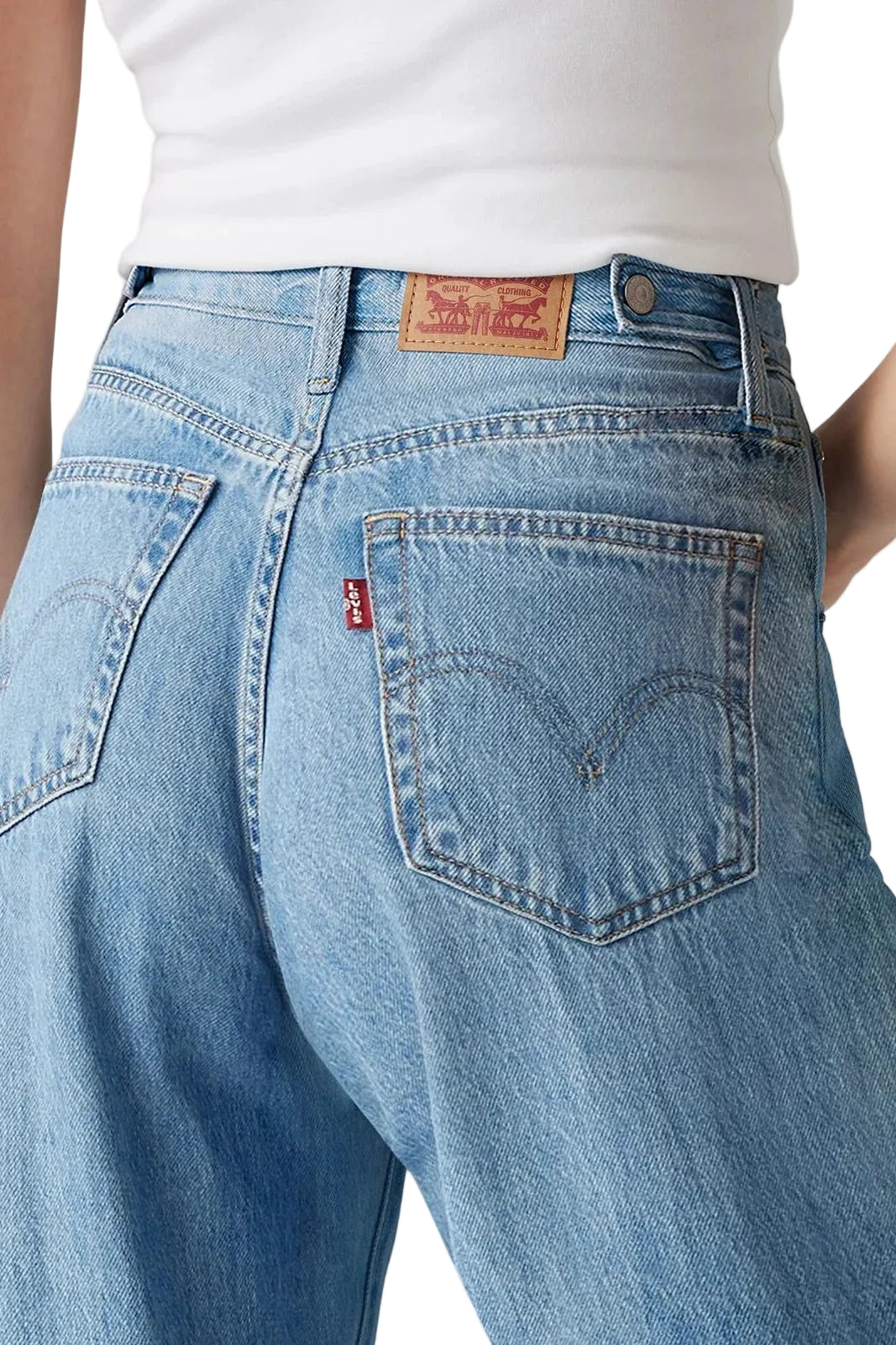 Blue jeans with a Levi's logo on a plain background