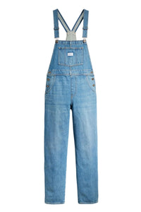 Blue denim overalls on a white background