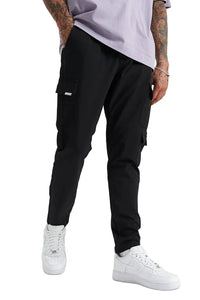 Person wearing black cargo jogger pants and white sneakers on a white background