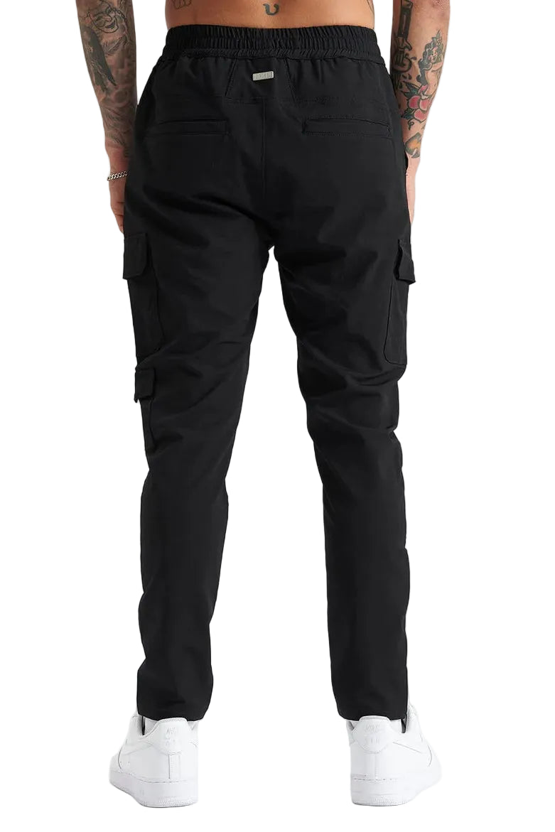 Black cargo pants worn by a person on a white background